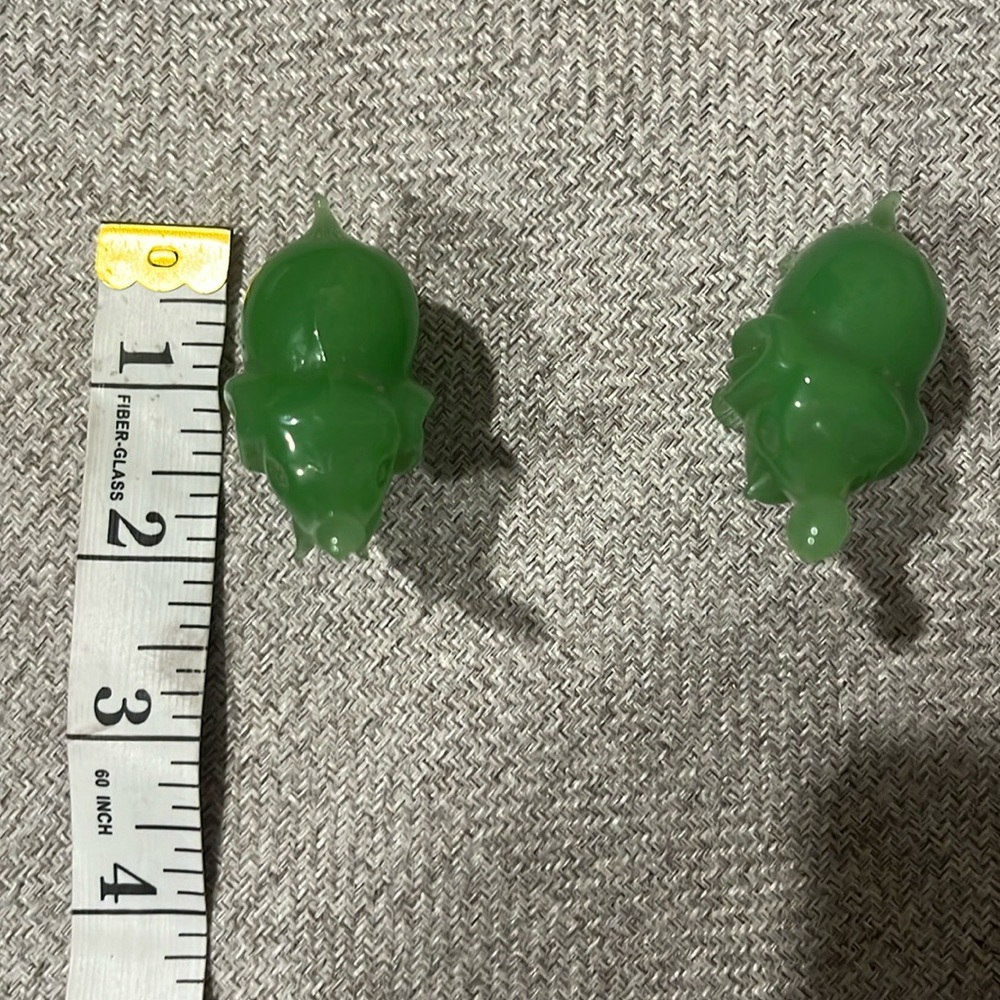 2 small green elephants
